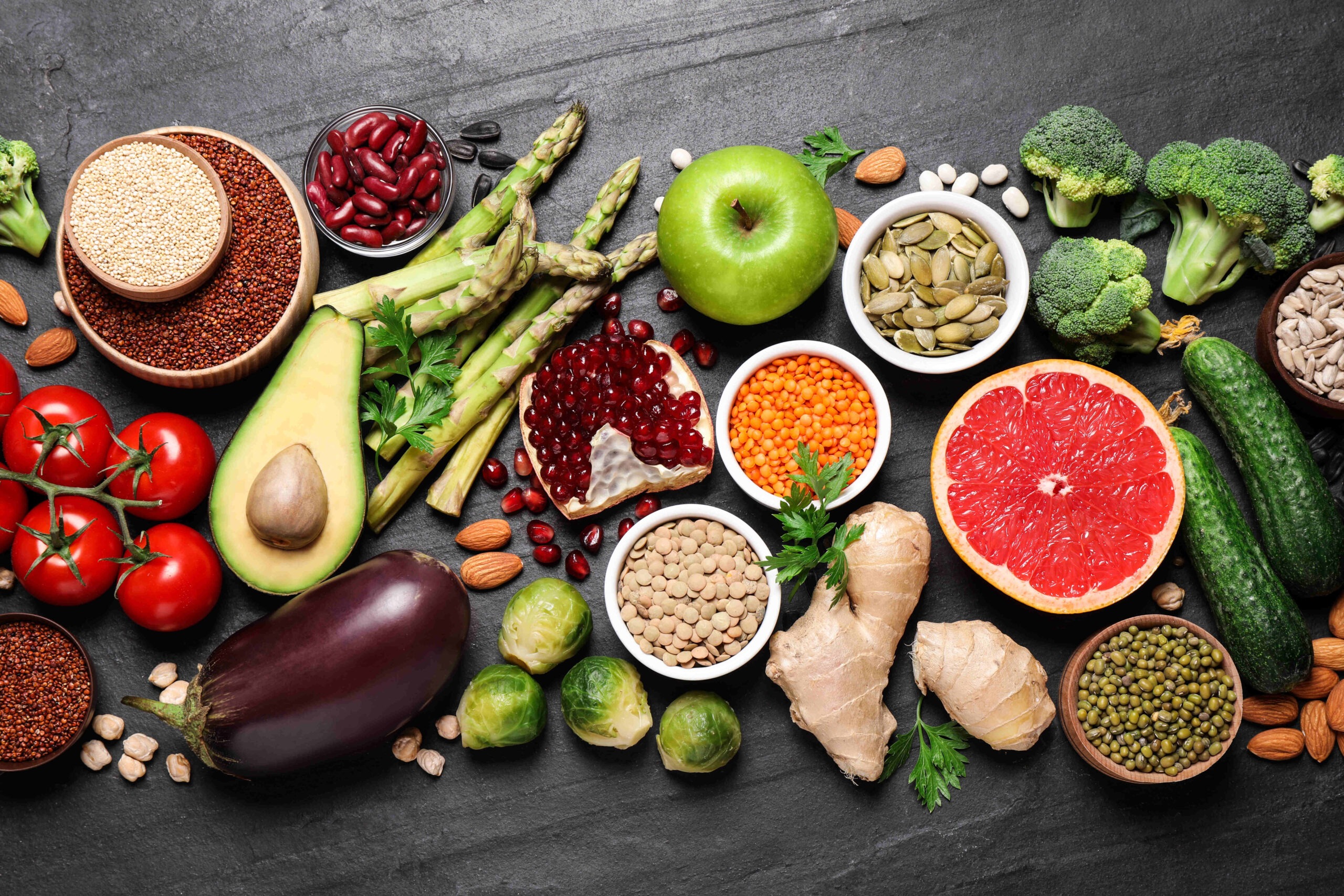 fresh-vegetables-fruits-and-seeds-on-black-table-flat-lay